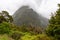 Impressive rainforest and mountains surrounded by beautiful clouds, Milford Sound highway, New Zealand