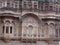 Impressive reddish-toned facade of the Mehrangarh Fort in the blue city of Jodhpur, India