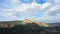 An impressive rocky summit above the countryside