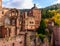Impressive romantic medieval castle fortress with moat, tower, wall in Heidelberg, Germany