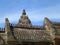 Impressive Roof details of Ancient Khmer Temple against sunny blue sky, Thailand
