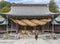 Impressive shinto sacred shimenawa rope hangs on the Miyajidake Shrine of Kyushu.