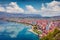 Impressive spring cityscape of Pogradec town. Beautiful outdoor scene of Ohrid lake