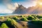 Impressive summer view of green dunes on the Stokksnes headland with Vestrahorn Batman mountain on background, southeastern