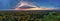 Impressive sunrise over Munich - drone shot over the Englischer Garten of the bavarian capital as great background pano