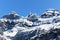 Impressive sÃ¤ntis mountain during the day with bright sunshine and beautiful blue cloudless sky, with the transmission tower for