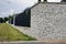 Impressive and very durable fence of the property made of split granite. Fence