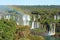 Impressive view of Iguazu falls with a rainbow at Brazilian side, Foz do Iguacu town, Brazil