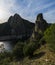 Impressive view of mountains and rocks with some greenery  in MonfragÃ¼e National Park in Spain