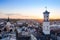 Impressive white tower stands tall above the skyline of a bustling urban cityscape