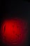 The imprint of the palm of human hand on glass on red background, in dark. Symvol reflection