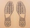 Imprint soles of sneakers on cardboard sheet. Imprint soles shoes - sneakers on cardboard background.