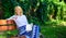 Improve your knowledge. Woman happy smiling blonde take break relaxing in garden reading book. Girl sit bench relaxing
