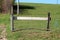 Improvised makeshift homemade backyard entrance doors made from combination of wooden boards and poles filled with plastic mesh