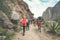 Inca Trail, Peru: August 11th, 2018:A group of hikers are walking on the famous Inca Trail with walking sticks. They will need to