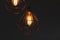 Incandescent light bulb on coppery light fixture