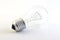 Incandescent lighted bulb on pure white