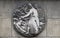 Incantation. Stone relief at the building of the Faculte de Medicine Paris.