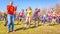 incendiary sports youth dances for the opening of the bike season in the city park on a spring sunny day