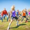 incendiary sports youth dances for the opening of the bike season in the city park on a spring sunny day