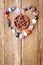 Incense burning in wooden pentagram burner with crystals in hear