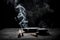 Incense smoke on a barren black stone table against a dark background