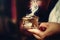 incense in a woman hand, incense smoke on a blur background.