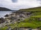 Inclined strata of fractured rock on Whale Voe at the Stuis of Graveland on the island of Yell in Shetland, UK