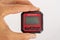 inclinometer, small device for measuring the level held between the fingers of one hand.