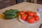 Include fresh organic vegetables on wooden floor. Cucumber and tomato on table background. rganic grower farm