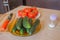 Include fresh organic vegetables on wooden floor. Cucumber and tomato on table background. rganic grower farm