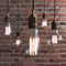 Included electric lamps on a brick wall background. Edison lamp