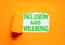 Inclusion and wellbeing symbol. Concept words Inclusion and wellbeing on beautiful white paper. Beautiful orange background.