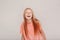 Inclusive Beauty. Girl with freckles standing isolated on grey laughing happy