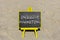 Inclusive marketing symbol. Concept words Inclusive marketing on beautiful black blackboard. Beautiful sand beach background.