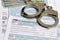 Income tax return documents and handcuffs.