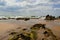 Incoming tide on sand and rocks