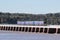 Incoming tide with train on Arnside Viaduct