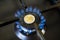 Increase in the cost of the gas bill, euro coin and gas stove turned on