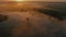 Incredible aerial photography of morning fog over the lake. Lush clouds fly past the camera. 