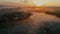 Incredible aerial photography of morning fog over the lake. Lush clouds fly past the camera.