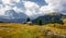 Incredible alpine highlands in summer in Dolomites Alps. Scenic image of famous Sassolungo peak. Splendid landscape in