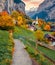 Incredible autumn view of great waterfall in Lauterbrunnen village