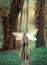 Incredible fairy walks in the autumn forest. A blonde girl with very long hair, unusual styling. Elf in a green dress