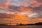 Incredible Golden sunset over the river Tagus, Bridge April 25 and the port of Lisbon, Portugal.