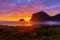 Incredible midnight sunset over the sea of Vik beach, Lofoten Islands,  Norway