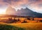 Incredible Nature Landscape. Awesome Dolomites Alps during sunrise. Fairytale green alpine plateau Seiser Alm Alpe di Siusi with