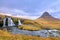 Incredible Nature landscape of Iceland. Fantastic picturesque sunset over Majestic Kirkjufell (Church mountain) and waterfalls.