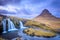 Incredible Nature landscape of Iceland. Fantastic picturesque sunset over Majestic Kirkjufell (Church mountain) and waterfalls.