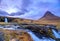 Incredible Nature landscape of Iceland. Fantastic picturesque sunset over Majestic Kirkjufell (Church mountain) and waterfalls.